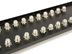 Angled view of F-type ports on 32 port coaxial patch panel - 2 of 4