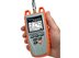 Platinum Tools orange Snap shot Cable fault finder, being held in palm, with display screen on - 1 of 2